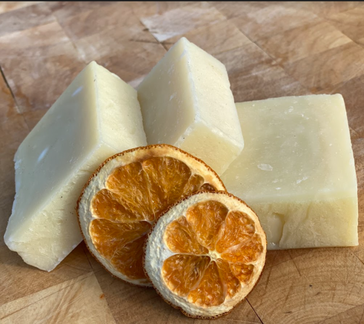 Three natural Aloe Vera soaps with two scented dried orange slices